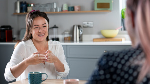 Woman signing to person